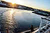 Utseiling med MS 'Polarlys' fra Trondheim i vakker vinteridyll. Om bord er idyllen dempet. Flere er skeptiske til salget av Hurtigruten.