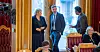 Erna Solberg diskuterer med statsrådene Henrik Asheim og Abid Raja.