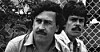 Pablo Escobar på en fotballkamp i Medellin i 1983. Til høyre for seg har han en ikke identifisert sikkerhetsvakt.