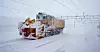 En Beilhack snøfreser rydder jernbanesporet for snø på Finse Stasjon. Finse stasjon er den høyestliggende stasjonen på Bergensbanen og ligger 1222 meter over havet.