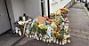 Tente lys og blomster utenfor huset på Kampen i Oslo hvor Tamima Nibras Juhar (34) ble drept mens hun var på jobb i en bolig tilknyttet barnevernet.