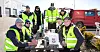 SAMLET I STREIKEN: Medlemmer fra FLT og Fellesforbundet gjør felles front i streiken. F.v. Espen Furuly (FLT), Erik Hasselø, John Georg Edseth, Mikkel Granerud, Emil Falk, Joakim Kvithyll Guldseth, Ole-Kristian Granheim (alle fra Fellesforbundet) og Asgeir Bidtnes (FLT).