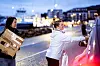 Iselin Blakkestad fra LO Møre og Romsdal går i front mens Anita Ukkelberg bærer esken med poser for henne.