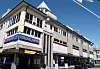 TREDJE ETASJE: Her til høyre ligger Folkets Hus sine lokaler i Haugesund. Inngangen er under Rema-skiltet.